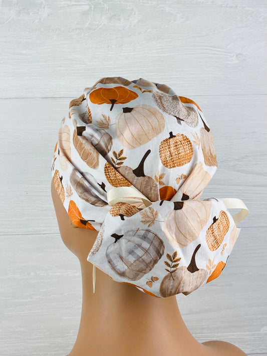 Patterned Pumpkins on Cream Ponytail Scrub Hat