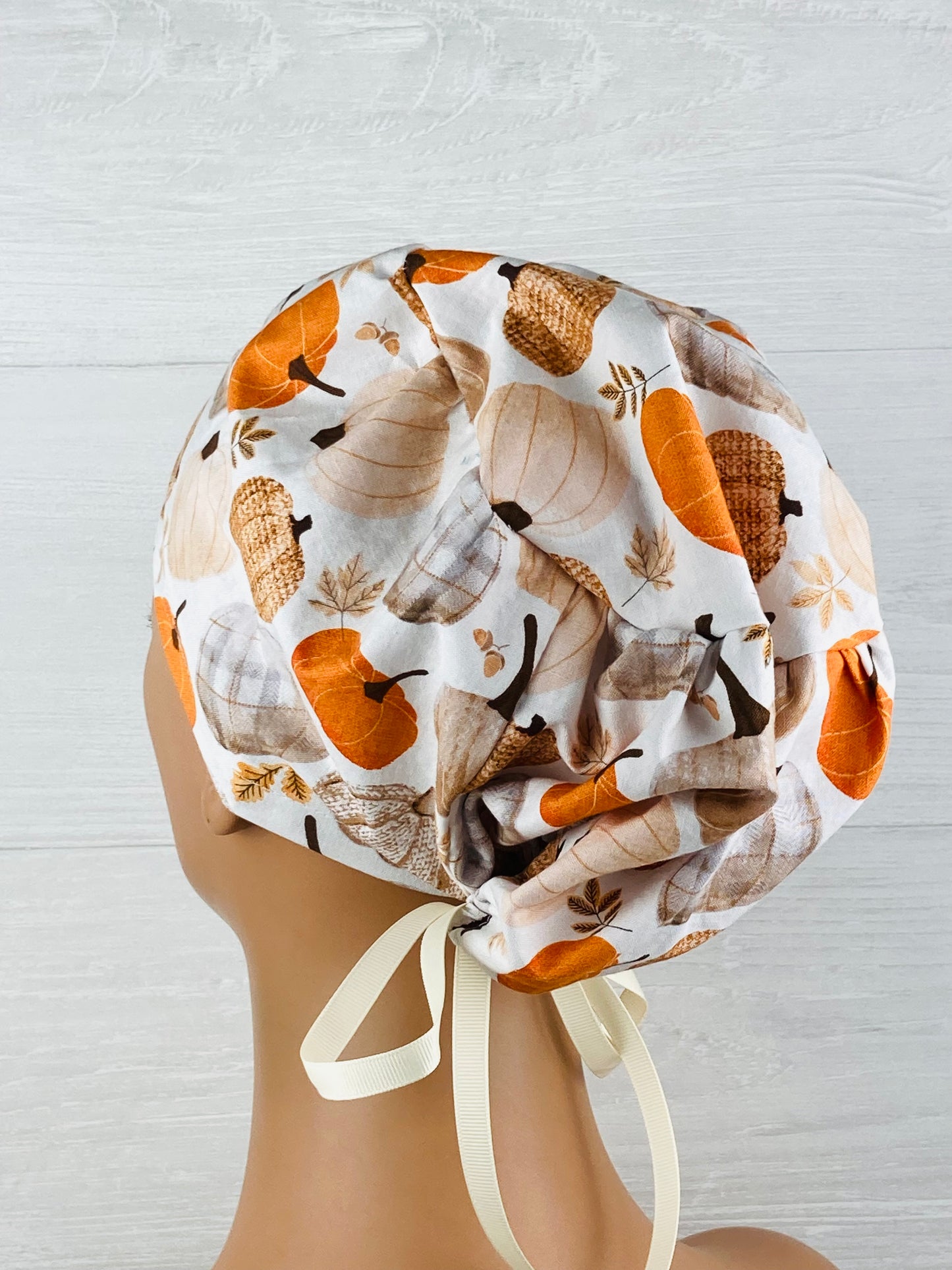 Patterned Pumpkins on Cream Women's Tieback Hat